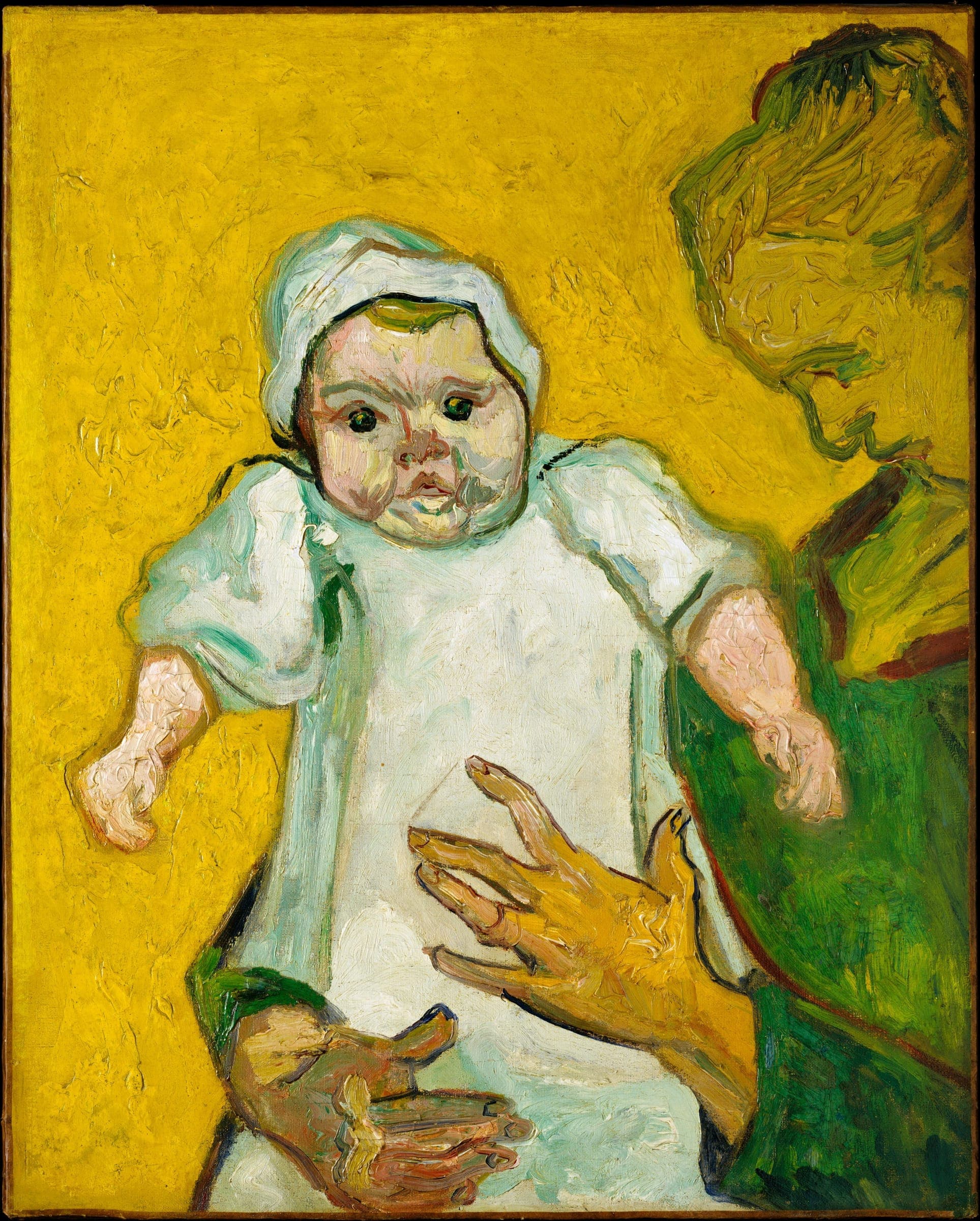 A woman in a dark dress holds a baby in a white gown, against a deep blue background.